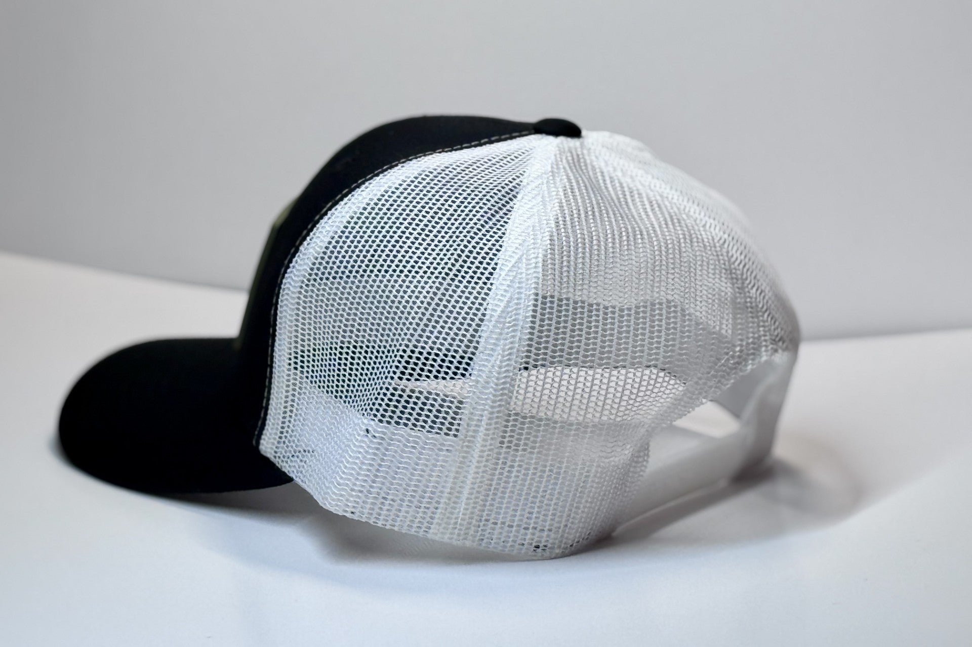 HAT BLACK ON WHITE MESH HERE FOR THE VIOLENCE